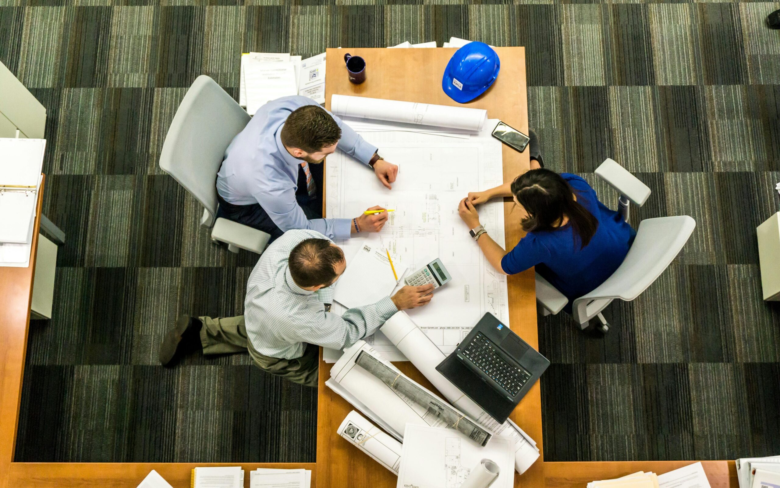 a group of people in an office desk